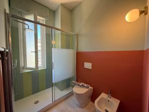 a bathroom with a toilet and a shower and a sink at House Farorosmarino by Holiday World in Chiavari +19 photos