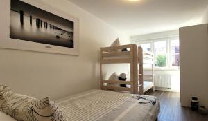 Postel nebo postele na pokoji v ubytování Warnemünde Strandnest 24350 + 12 fotografií