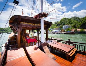 a wooden deck of a boat in the water at Halong Ocean Cruise 6 in Ðảo Cát Bà