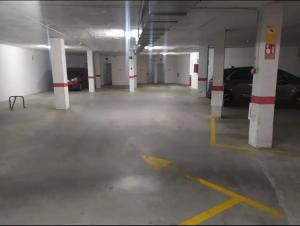 an empty parking garage with cars parked in it at Apartamento torrox in Torrox Costa