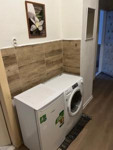 a washer and dryer in a laundry room at Budget Single Room Old Town in Košice