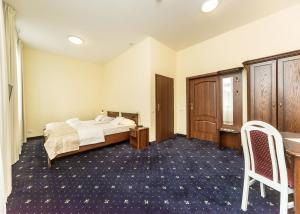 Postel nebo postele na pokoji v ubytování Hotel Marczewski