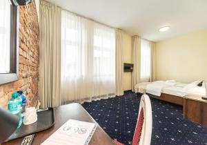 TV a/nebo společenská místnost v ubytování Hotel Marczewski