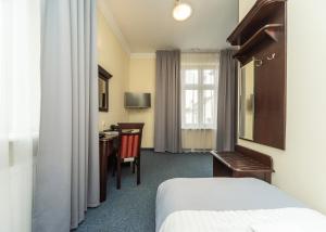 Postel nebo postele na pokoji v ubytování Hotel Marczewski