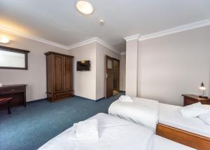 Postel nebo postele na pokoji v ubytování Hotel Marczewski