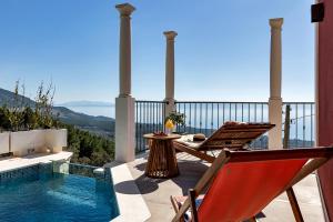 a patio with a pool and a chair and a table at Villa Natalija - Makarska Exklusiv in Baška Voda