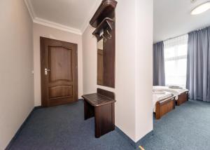 Postel nebo postele na pokoji v ubytování Hotel Marczewski