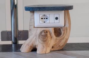 a table made out of a bear with a socket at Domus Minerva in Massa Lubrense