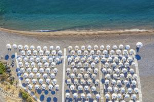 an aerial view of a parking lot with umbrellas at Lindos Royal Resort in Líndos