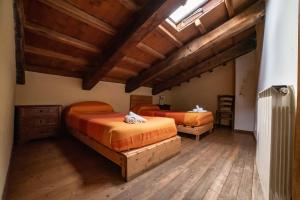 Albergo Diffuso - Rocca Calascioにあるベッド