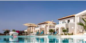 a view of the villas from the swimming pool at Kaladi Rock Ammos in Avlemonas +26 photos