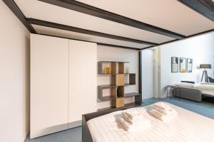 a bedroom with a bed and a bed frame at New Luxury Loft - Prada-Bocconi in Milan
