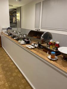 a buffet line in a restaurant with food on it at Star Hotel Chiang Mai in Chiang Mai