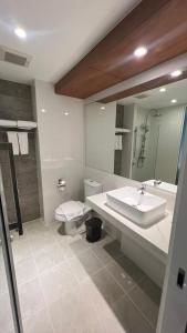 a bathroom with a sink and a toilet and a mirror at Star Hotel Chiang Mai in Chiang Mai +59 photos