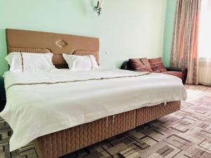 Voodi või voodid majutusasutuse SD Hotel toas