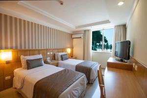 Кровать или кровати в номере Hotel Astoria Palace