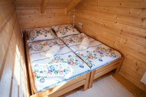A bed or beds in a room at Chata Kaprík 35