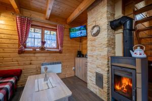 A television and/or entertainment centre at Chata Kaprík 35