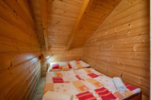 A bed or beds in a room at Chata Kaprík 35