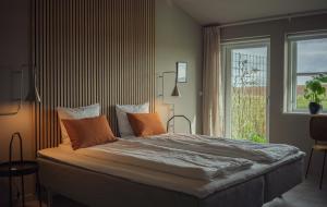 Postel nebo postele na pokoji v ubytování Ellevilde Boutique Hotel