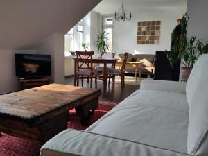 a living room with a couch and a table at Stadtvilla in Kiel