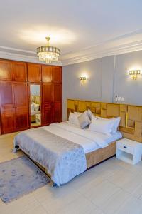 Ένα ή περισσότερα κρεβάτια σε δωμάτιο στο G&G Residency BONAPRISO