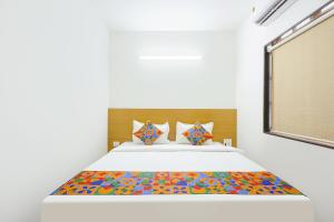 Ένα ή περισσότερα κρεβάτια σε δωμάτιο στο Via Pednekar Plaza - Nr Baga Beach