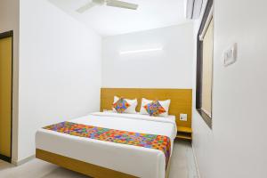 Ένα ή περισσότερα κρεβάτια σε δωμάτιο στο Via Pednekar Plaza - Nr Baga Beach