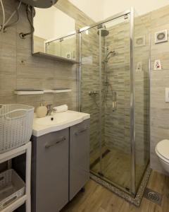 a bathroom with a shower and a sink and a toilet at Apartments Tanja & Josipa in Pag +92 photos