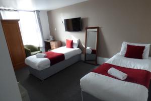 Postel nebo postele na pokoji v ubytování Midlands Hotel