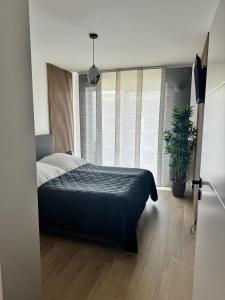 Ένα ή περισσότερα κρεβάτια σε δωμάτιο στο STAR Apartament & Spa 2 Dziwnów