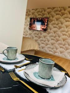 TV a/nebo společenská místnost v ubytování Chambre d'hôtes Stellina Bed&Breakfast avec vue sur jardin arboré