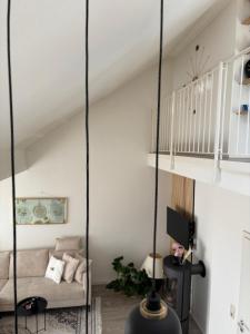 a living room with a swing in the ceiling at ERBEX to in Dietzenbach