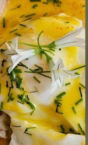a plate of food with white flowers on it at No 12 B&B in Dungarvan