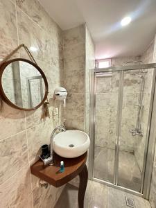a bathroom with a sink and a shower at Sevil new apart in Istanbul +41 photos