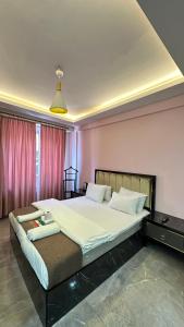 a bedroom with a large bed in a room at Sevil new apart in Istanbul