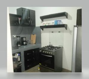 Kuchyň nebo kuchyňský kout v ubytování Appart Ker L'AM