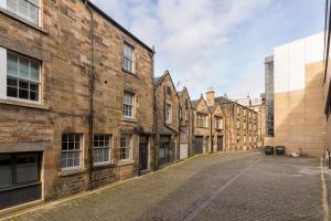 an empty street in an old brick building at Destiny Scotland Apartments at Canning Street Lane in Edinburgh