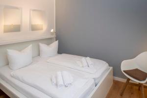 En eller flere senge i et værelse på Ferienwohnung 'Uli'