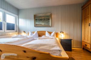 En eller flere senge i et værelse på 'Marintje'