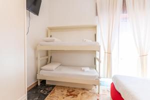 Postel nebo postele na pokoji v ubytování Tombolata