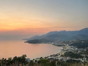 a view of a city and a body of water at Vila Llaka in Himare