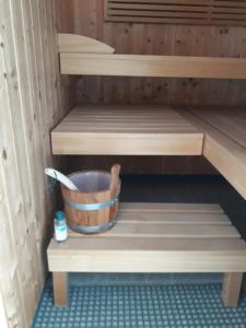a bucket is sitting on the inside of a sauna at Lichtdurchflutetes Atelierhaus mit Skulpturenpark in Düren - Eifel