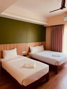Een bed of bedden in een kamer bij Hotel Quest