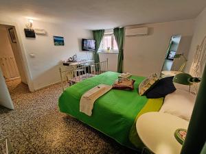 Posteľ alebo postele v izbe v ubytovaní B&B Perla