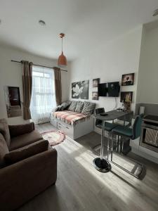 Posezení v ubytování Cozy, modern flat in Govan + 14 fotografií
