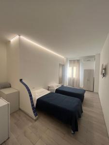 Postel nebo postele na pokoji v ubytování piazza Marconi Rooms