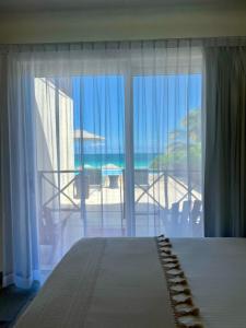 Postel nebo postele na pokoji v ubytování El Paraiso Hotel Tulum