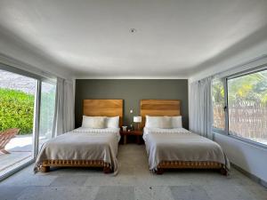 Postel nebo postele na pokoji v ubytování El Paraiso Hotel Tulum + 37 fotografií