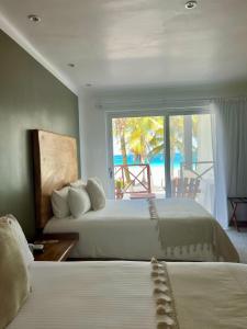Postel nebo postele na pokoji v ubytování El Paraiso Hotel Tulum